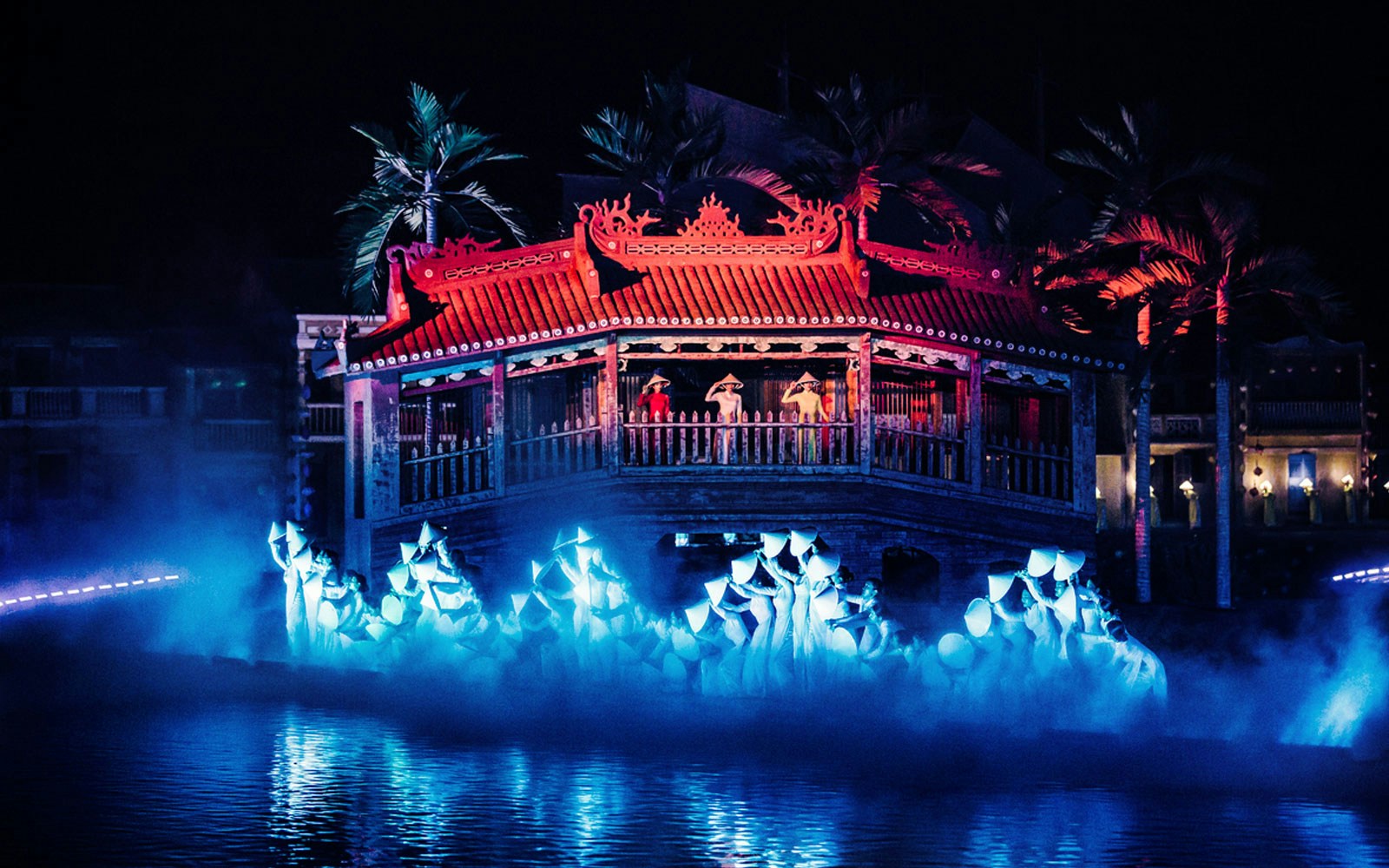 Hoi An Memories Show in Vietnam with performers on a lit stage by the water.