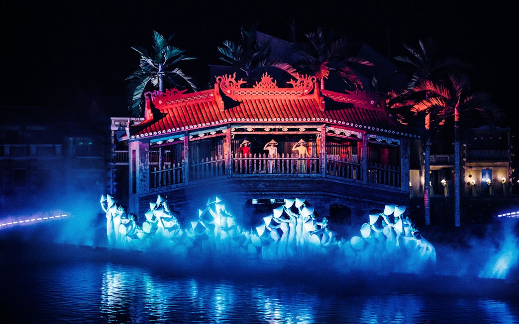 Hoi An Memories Show in Vietnam with performers on a lit stage by the water.