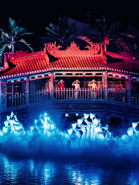 Hoi An Memories Show in Vietnam with performers on a lit stage by the water.