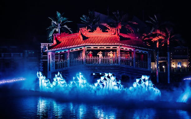 Hoi An Memories Show in Vietnam with performers on a lit stage by the water.