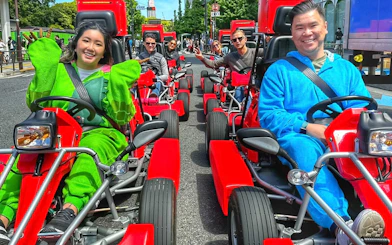 Tourists in costumes driving go-karts on the street in Akihabara, Tokyo.