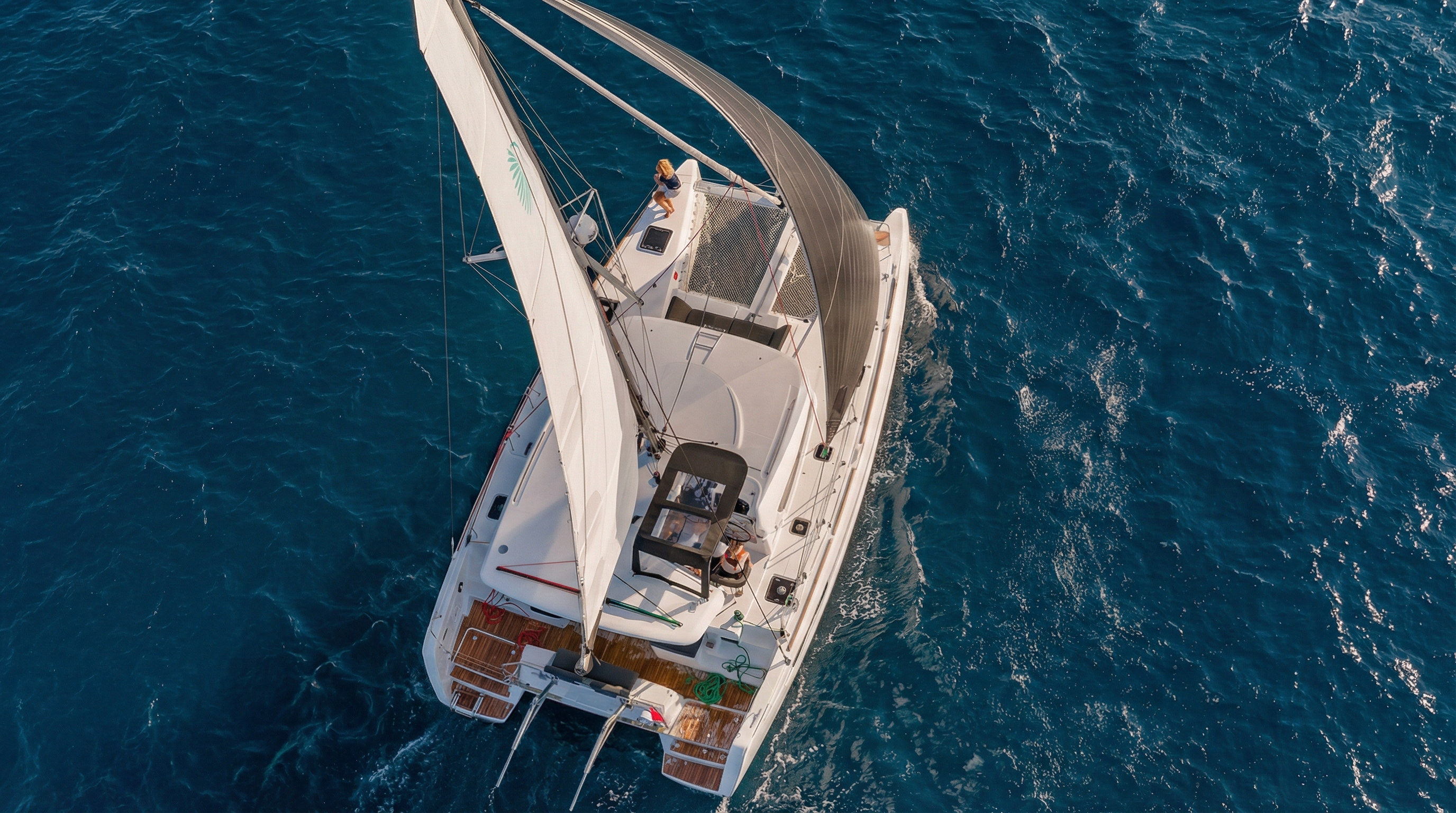 Catamaran sailing on blue waters during La Maddalena tour.