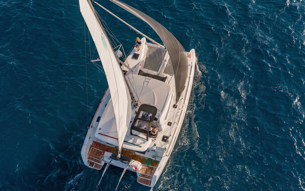 Catamaran sailing on blue waters during La Maddalena tour.