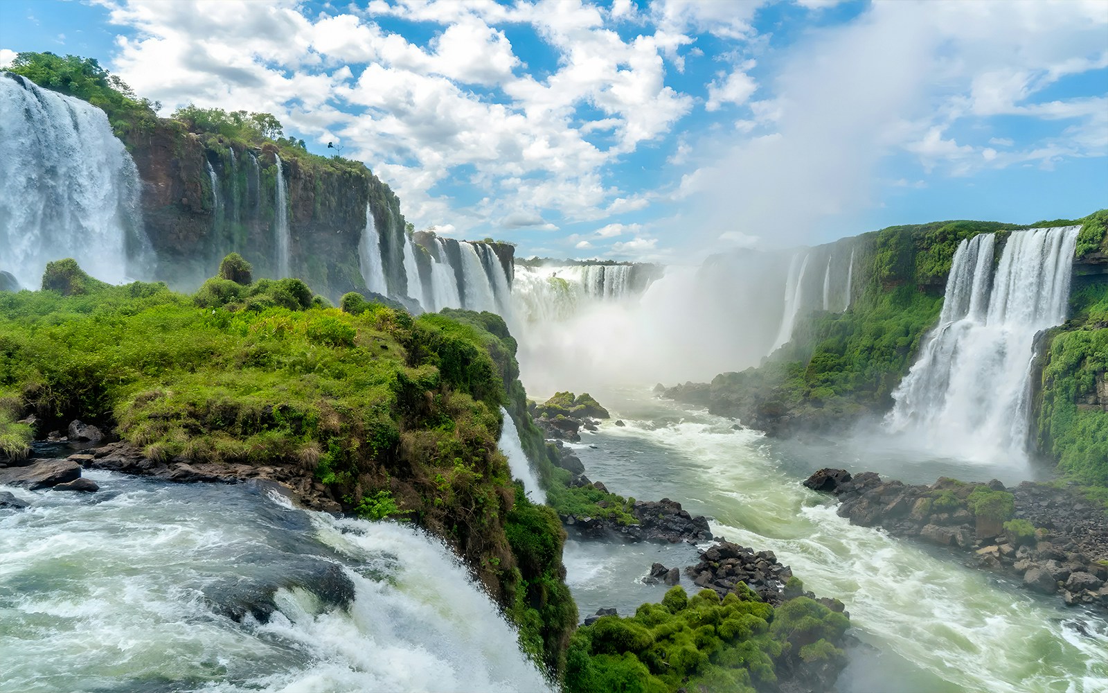 Iguazú Falls cascading over lush cliffs on the Brazilian side.
