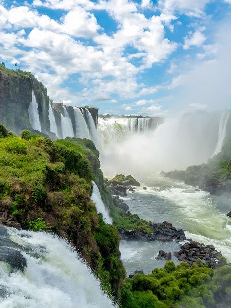 Iguazú Falls cascading over lush cliffs on the Brazilian side.