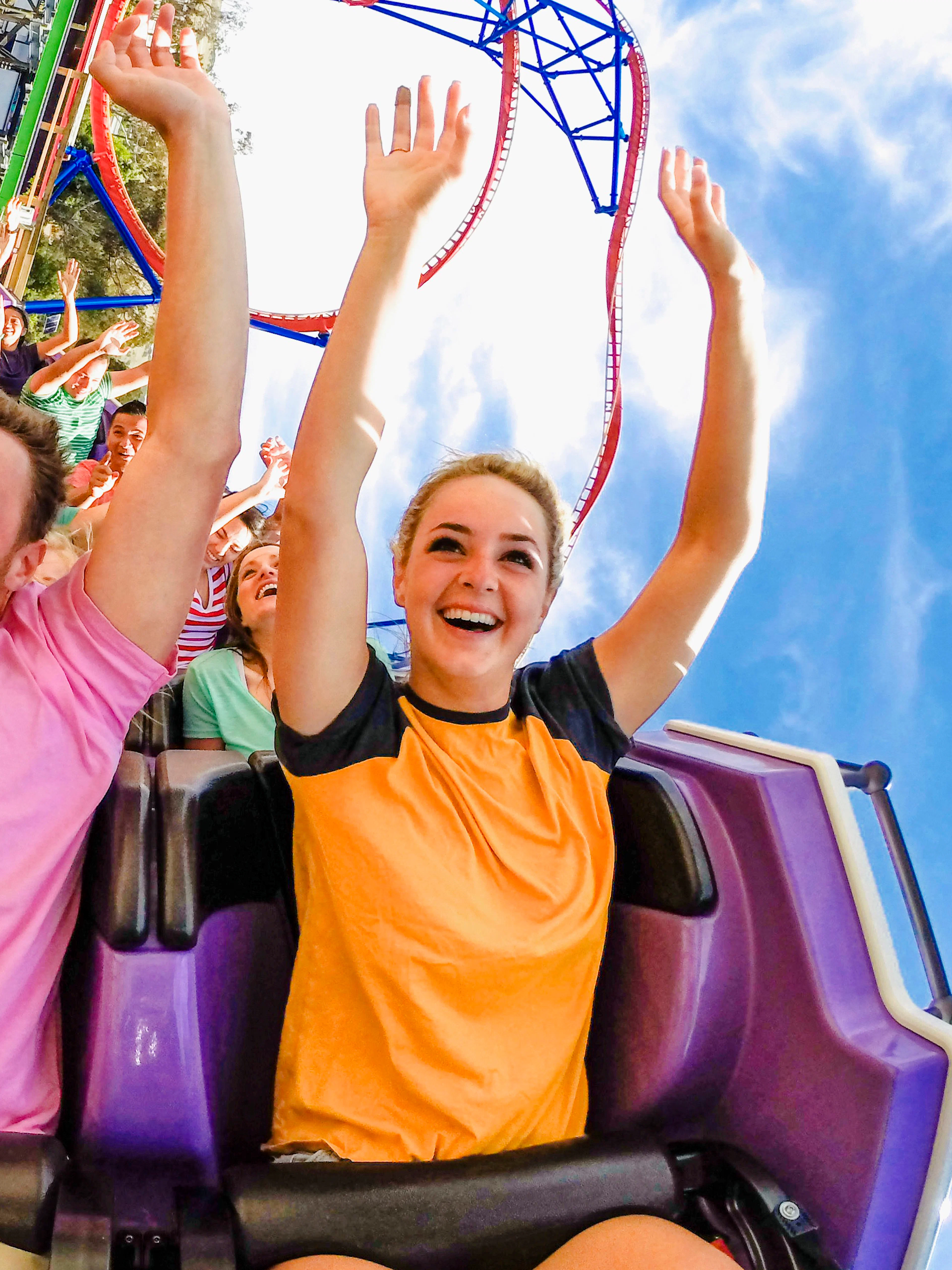 Riders enjoying The Joker roller coaster at Six Flags Discovery Kingdom.