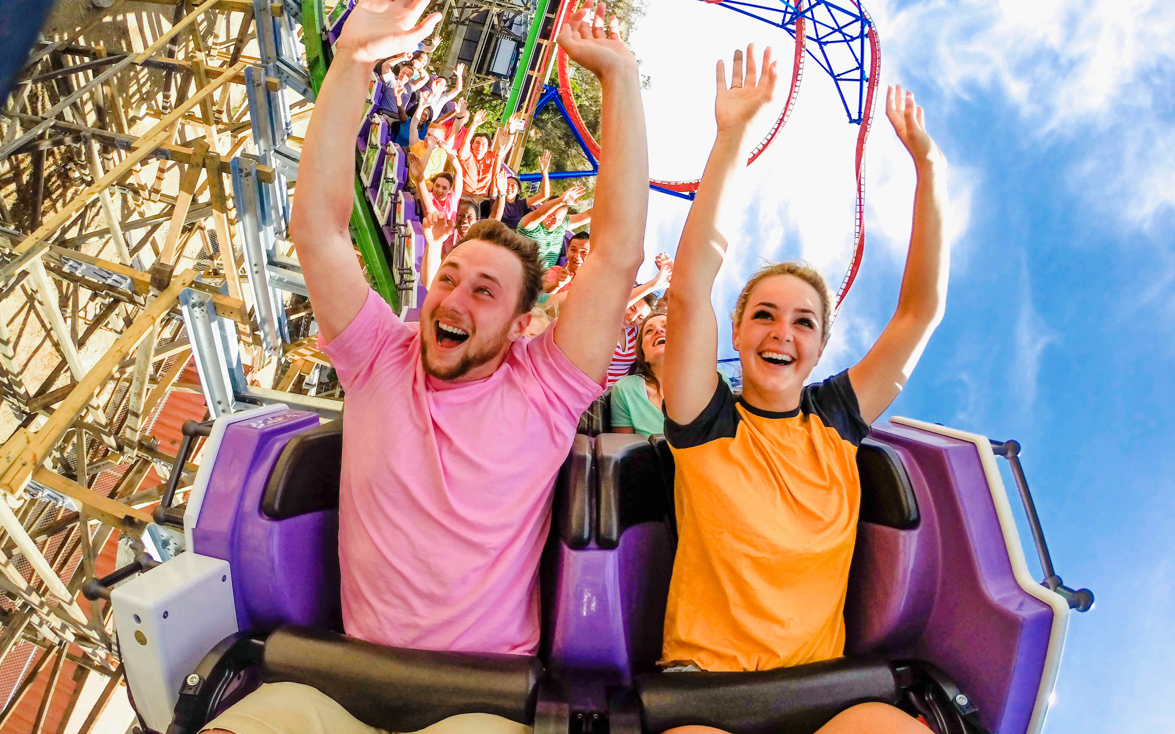 Riders enjoying The Joker roller coaster at Six Flags Discovery Kingdom.