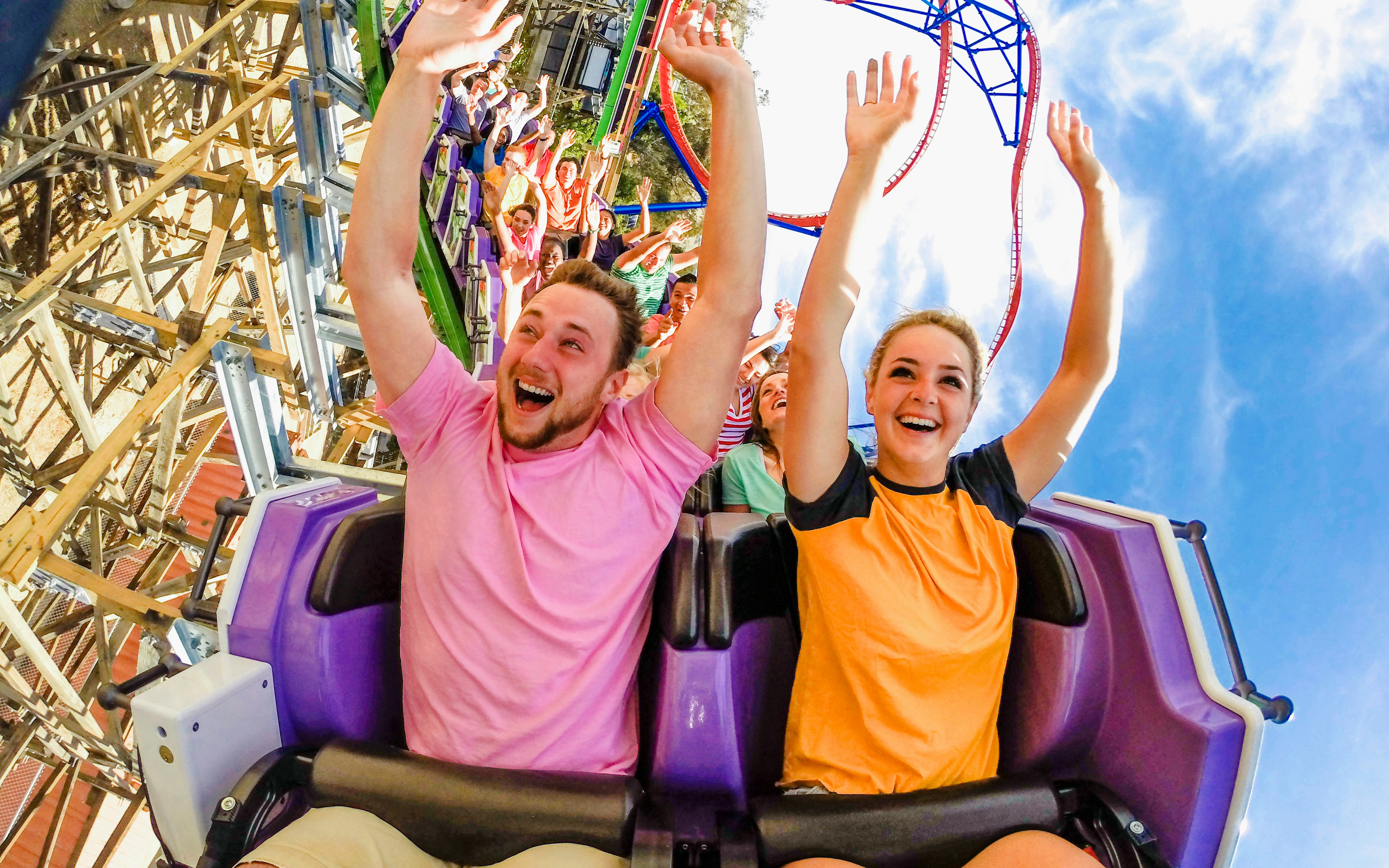 Riders enjoying The Joker roller coaster at Six Flags Discovery Kingdom.