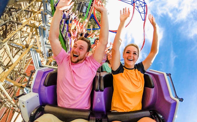 Riders enjoying The Joker roller coaster at Six Flags Discovery Kingdom.