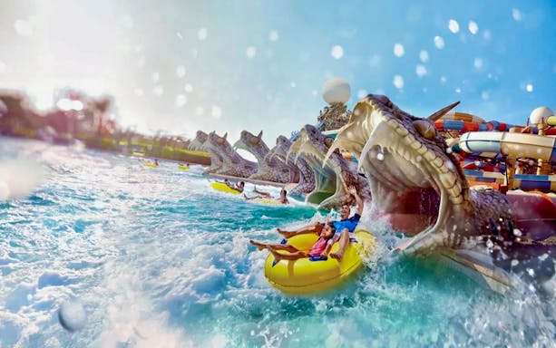 Visitors on a water ride at Yas Waterworld, Yas Island, Abu Dhabi.