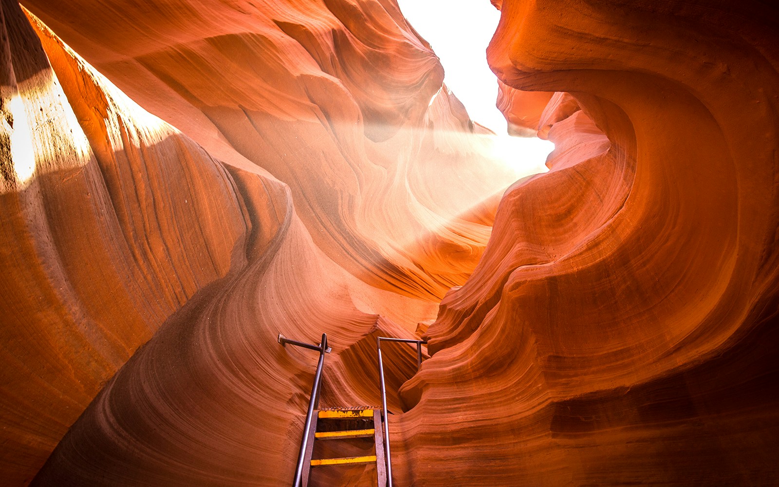 Antelope Canyon sandstone walls with sunlight streaming through, Arizona.