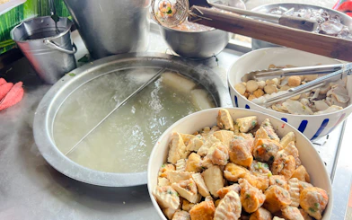 Street food preparation with assorted ingredients for noodle soup on the Taste of Chiang Mai Michelin Food Walking Tour.