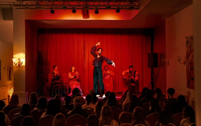 Flamenco dancers performing on stage at Laietana, Barcelona.