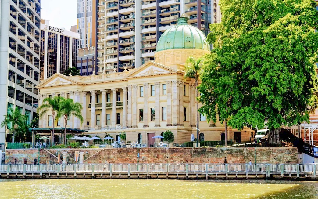 Brisbane Customs House with green dome seen from Brisbane River cruise.