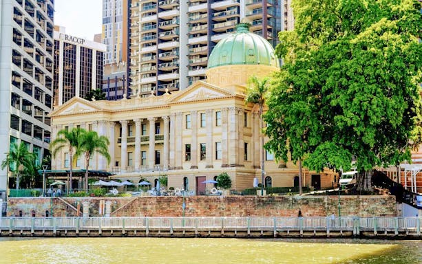 Brisbane Customs House with green dome seen from Brisbane River cruise.