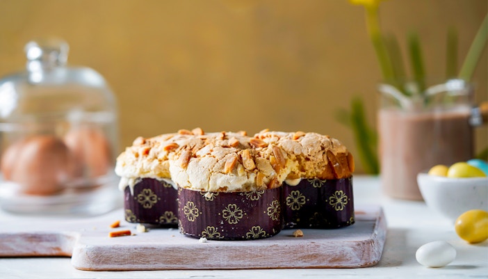 A delightful pastry showcasing a crunchy almond topping, set in a festive spring setting