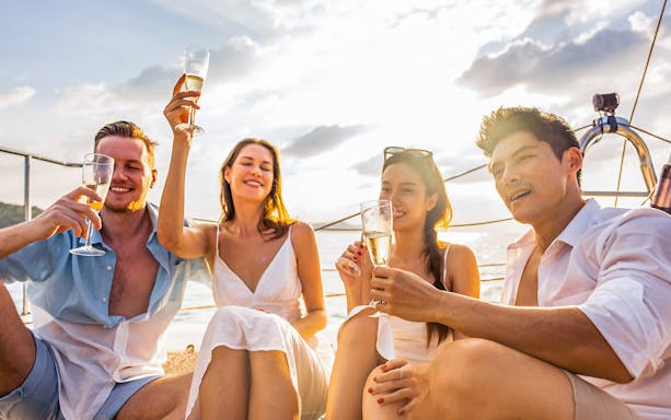 Group enjoying wine tasting on a boat tour in Favignana.