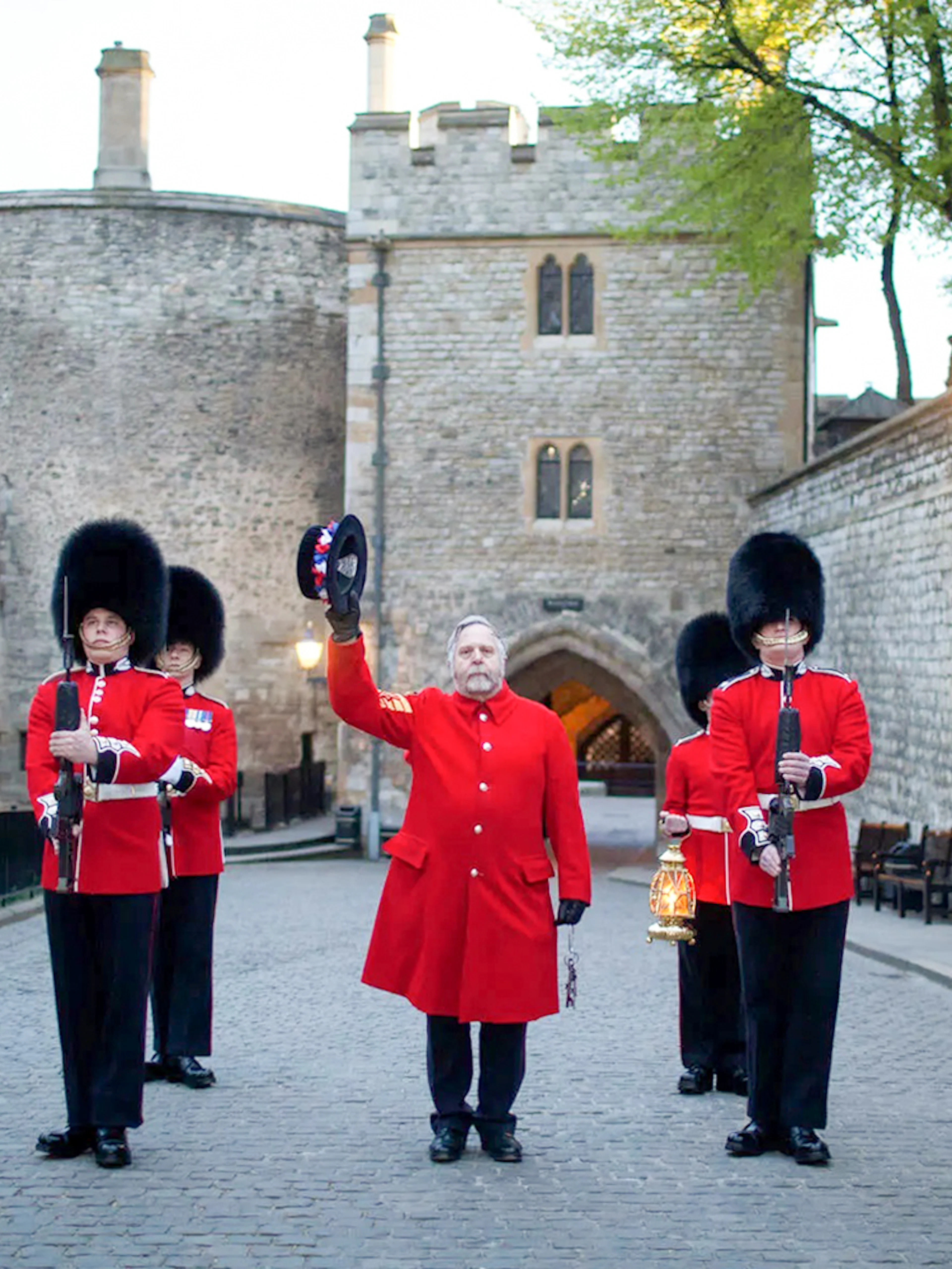 Guards in red uniforms at Tower of London during Ceremony of the Keys.