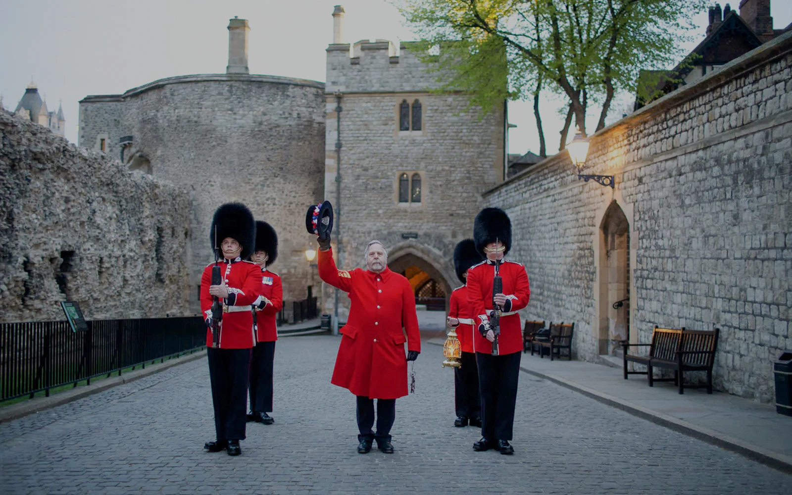 Guards in red uniforms at Tower of London during Ceremony of the Keys.