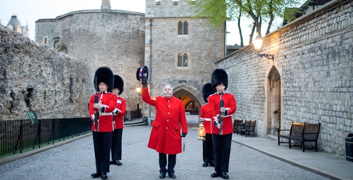 Guards in red uniforms at Tower of London during Ceremony of the Keys.