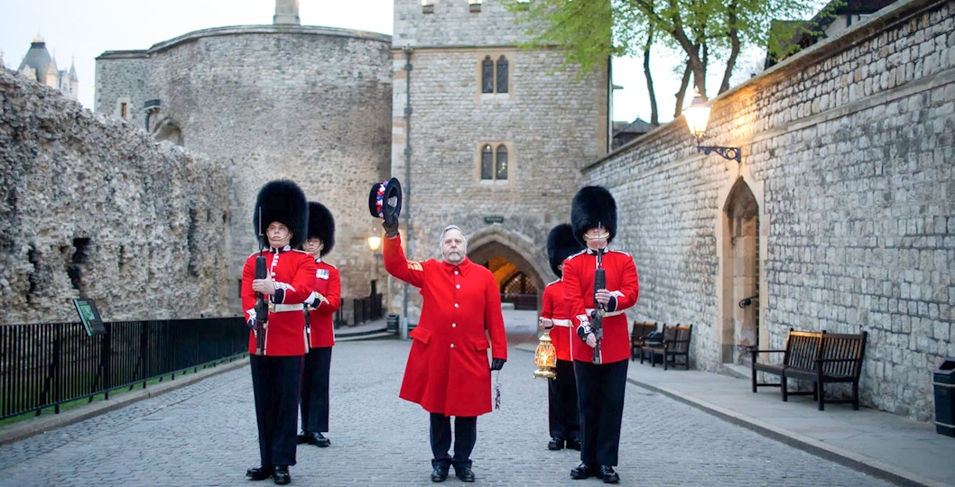 Guards in red uniforms at Tower of London during Ceremony of the Keys.