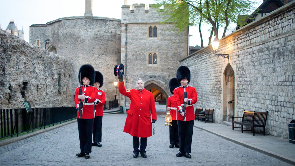 Guards in red uniforms at Tower of London during Ceremony of the Keys.