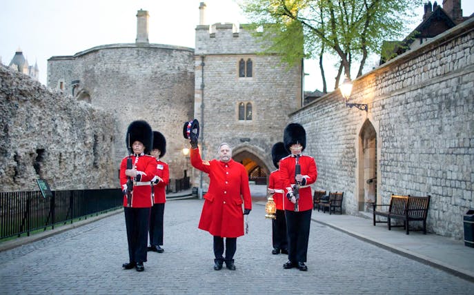 Guards in red uniforms at Tower of London during Ceremony of the Keys.