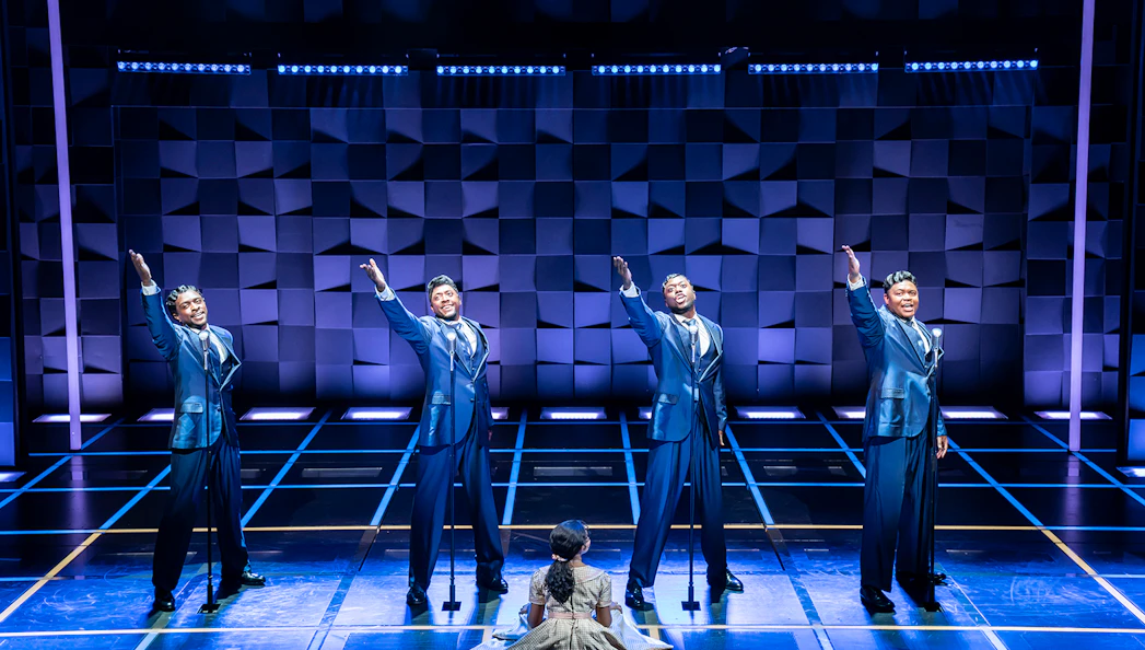 Performers on stage during "The Drifters Girl" musical.