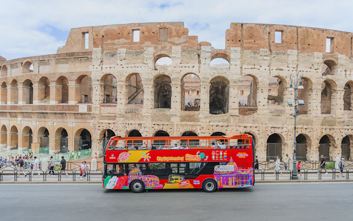 City sightseeing bus in front of the Colosseum, Rome.
