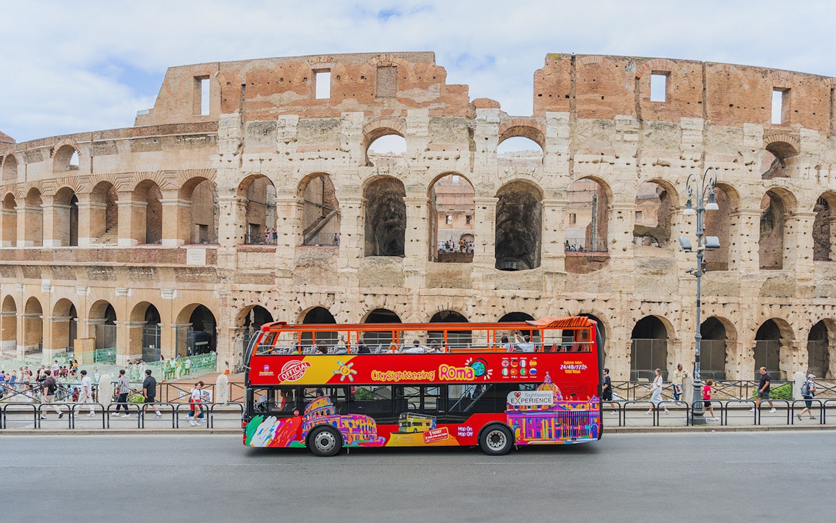 City sightseeing bus in front of the Colosseum, Rome.