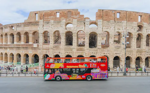 City sightseeing bus in front of the Colosseum, Rome.