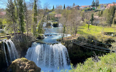 Waterfalls and greenery in Rastoke Village, Croatia, part of the Plitvice Lakes tour.
