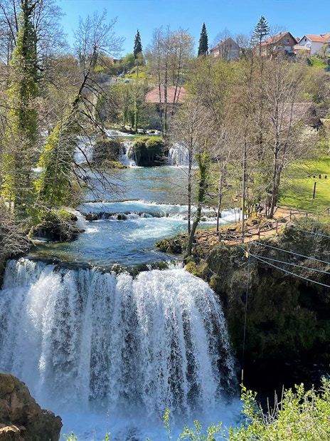 Waterfalls and greenery in Rastoke Village, Croatia, part of the Plitvice Lakes tour.