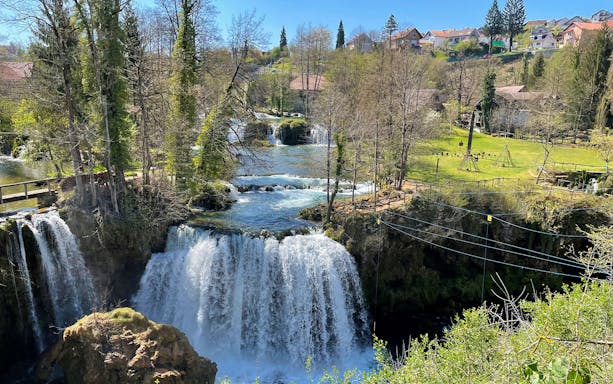 Waterfalls and greenery in Rastoke Village, Croatia, part of the Plitvice Lakes tour.