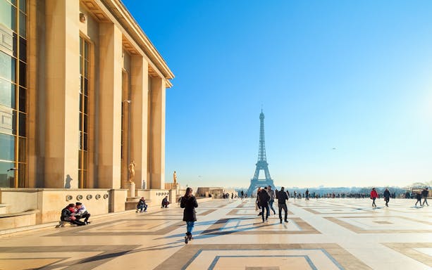 Visitors at Trocadéro Gardens with Eiffel Tower in background, Paris.
