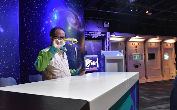 Petrosains staff demonstrating science exhibit in Kuala Lumpur.