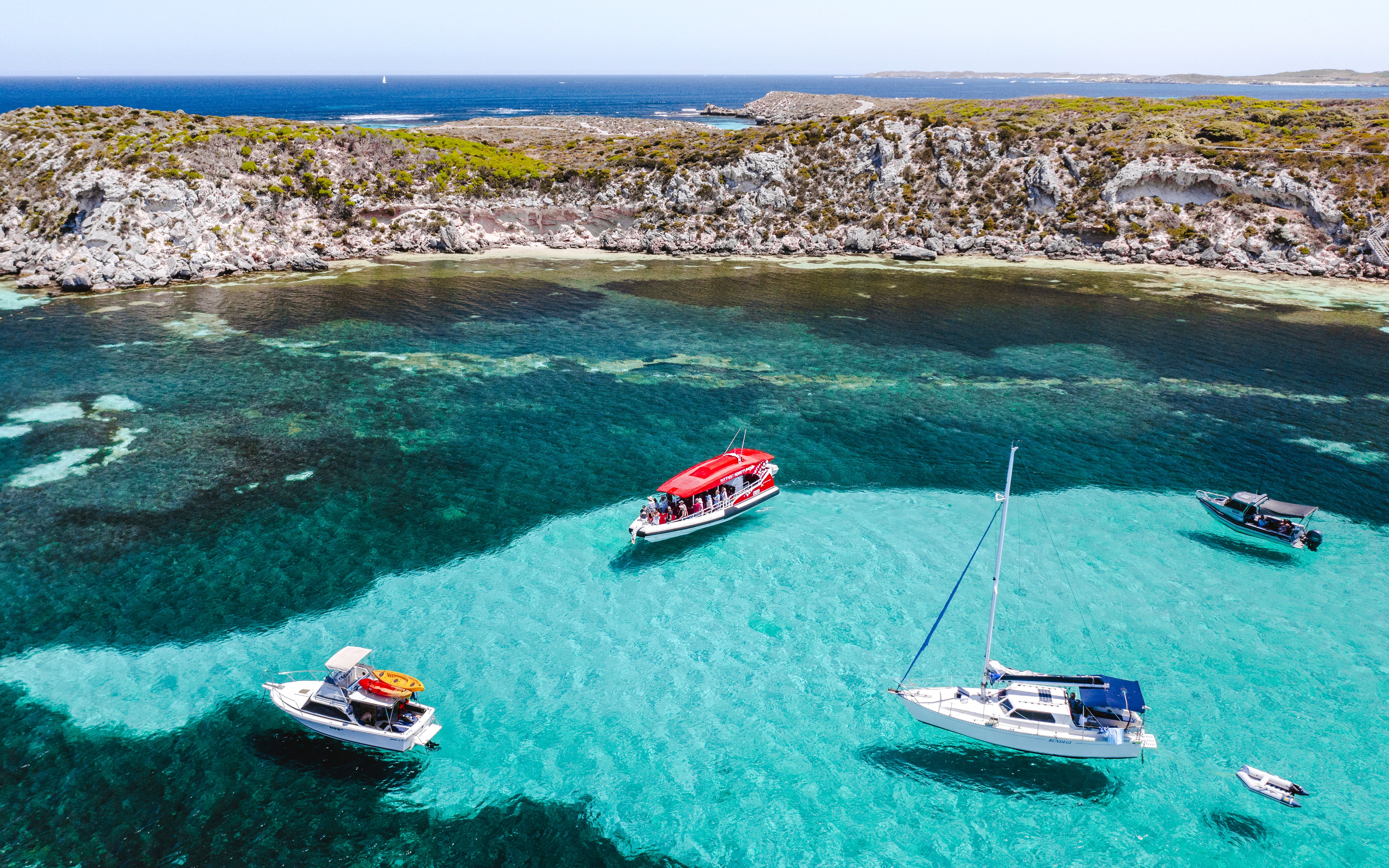 #Snorkel tour boats in turquoise waters near rocky coastline, Perth/Fremantle.