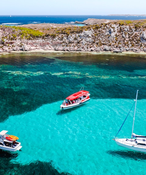 #Snorkel tour boats in turquoise waters near rocky coastline, Perth/Fremantle.