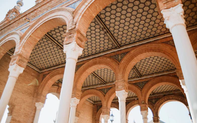 Arched ceilings and columns at the Royal Alcázar of Seville, Spain.