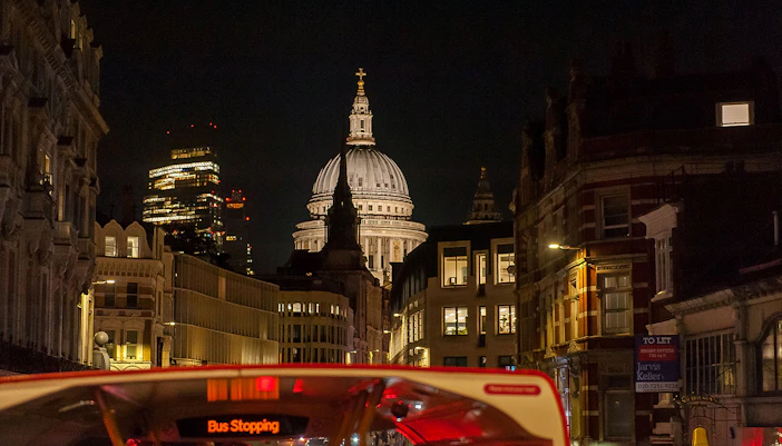 London night view from Tootbus with St. Paul's Cathedral in the background.