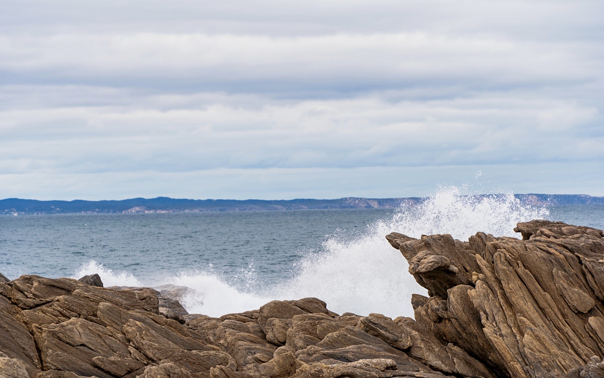Waves crashing against rocks at Vivonne Bay Rock Pool, Kangaroo Island, South Australia.