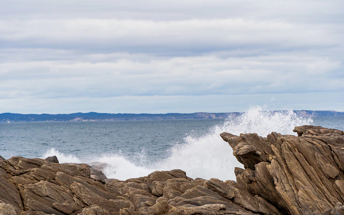 Waves crashing against rocks at Vivonne Bay Rock Pool, Kangaroo Island, South Australia.