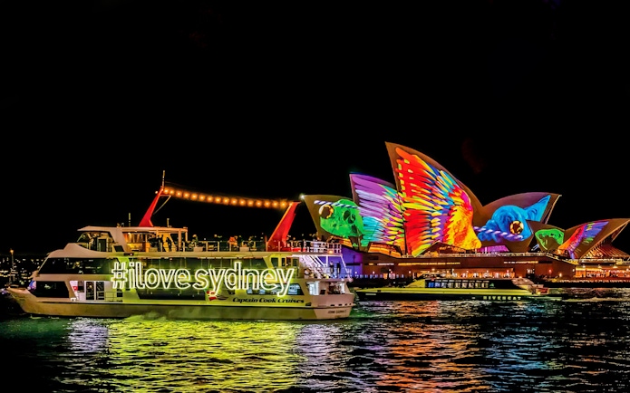 Sydney Opera House illuminated during Vivid Lights Cruise.