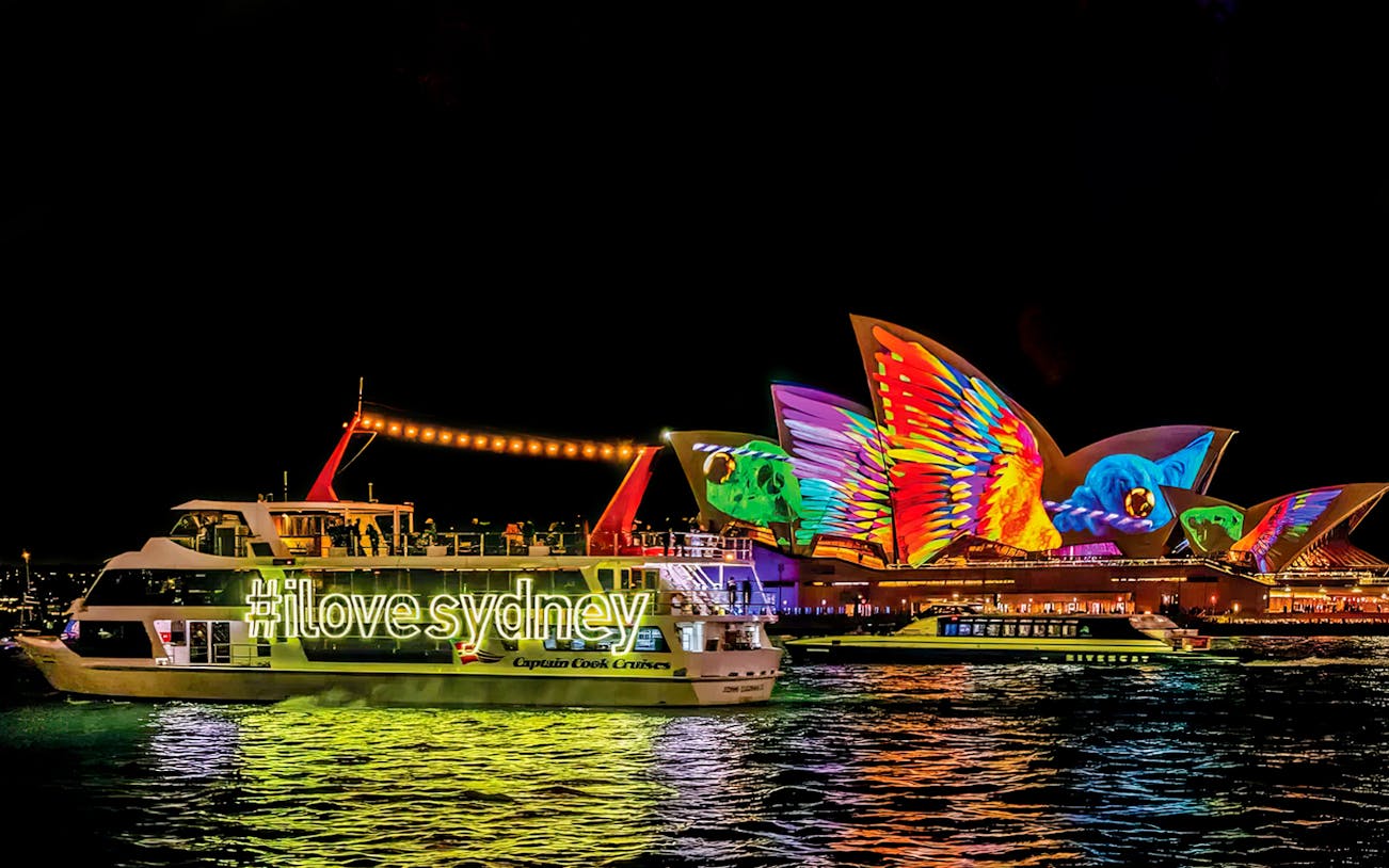 Sydney Opera House illuminated during Vivid Lights Cruise.