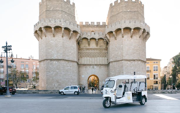 Tuk Tuk in front of Torres de Serranos, Valencia.