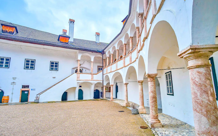 Schloss Ort courtyard with arched walkways and historic architecture in Hallstatt, near Vienna.