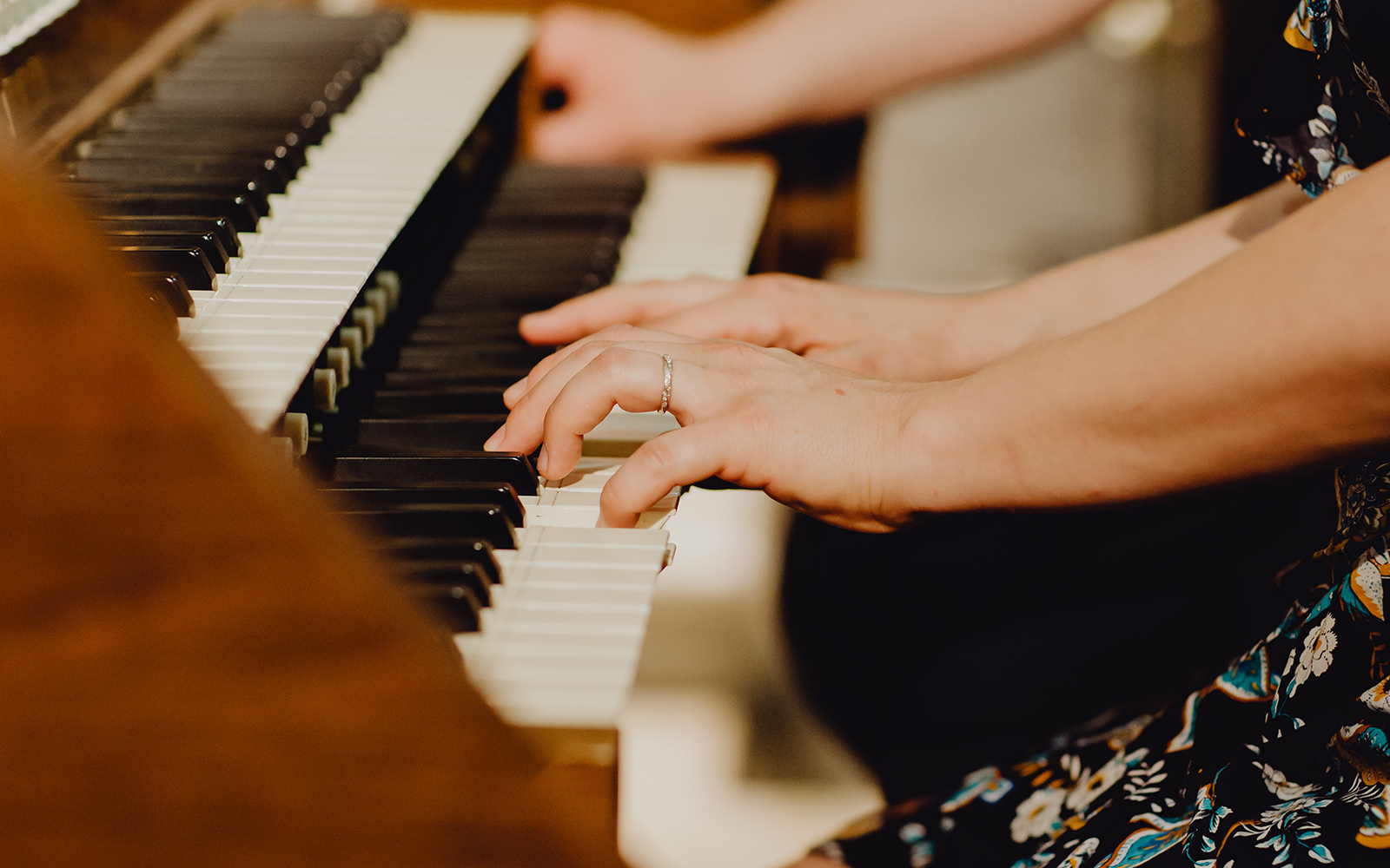 Baroque church interior with grand piano set for concert in ornate setting.