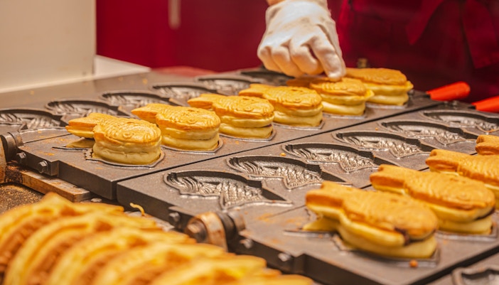 Grilling taiyaki in Tokyo, Japan.