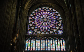 Notre Dame Cathedral rose window with intricate stained glass design.