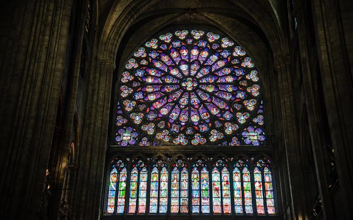 Notre Dame Cathedral rose window with intricate stained glass design.